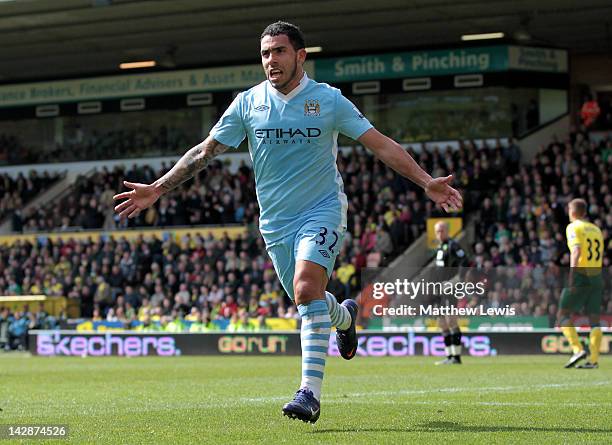 Carlos Tevez of Manchester City celebrates scoring his team's fifth goal to complete his hat trick during the Barclays Premier League match between...