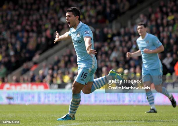 Sergio Aguero of Manchester City celebrates scoring his team's fourth goal during the Barclays Premier League match between Norwich City and...