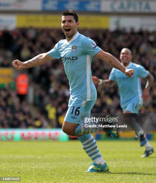 Sergio Aguero of Manchester City celebrates scoring his team's fourth goal during the Barclays Premier League match between Norwich City and...