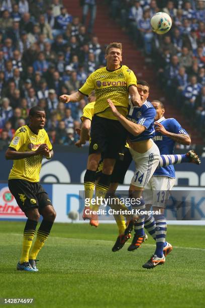 Lukasz Piszczek of Dortmund and Kyriakos Papadopoulos of Schalke go up for a header during the Bundesliga match between FC Schalke 04 and Borussia...