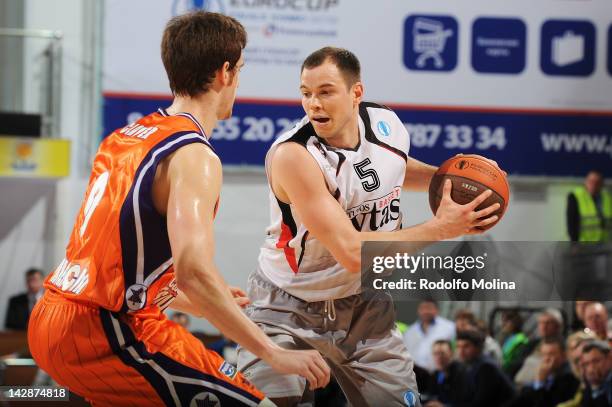 Steponas Babrauskas, #5 of Lietuvos Rytas competes with Victor Claver, #9 of Valencia Basket during the semifinal A of 2012 Eurocup Finals between...