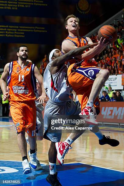 Brad Newley, #8 of Valencia Basket is challenged by Tyrese Rice, #6 of Lietuvos Rytas during the semifinal A of 2012 Eurocup Finals between Valencia...