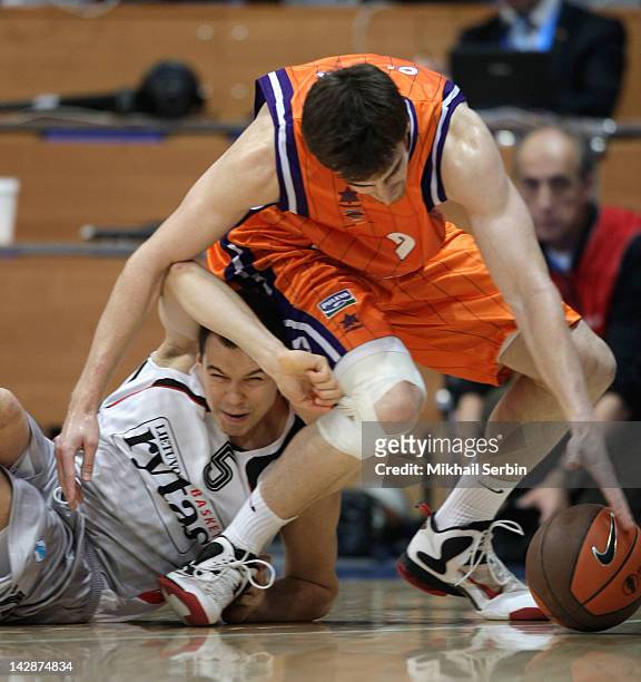 Victor Claver, #9 of Valencia Basket competes with Steponas Babrauskas, #5 of Lietuvos Rytas during semi-final A of the 2012 Eurocup Finals between...