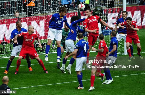 Andy Carroll of Liverpool scores his side's second goal during the FA Cup with Budweiser Semi Final match between Liverpool and Everton at Wembley...