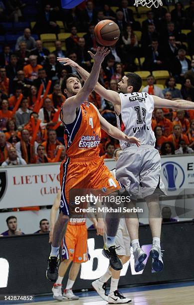 Stefan Markovic, #4 of Valencia Basket competes with Aleksandar Rasic, #19 of Lietuvos Rytas during semi-final A of the 2012 Eurocup Finals between...