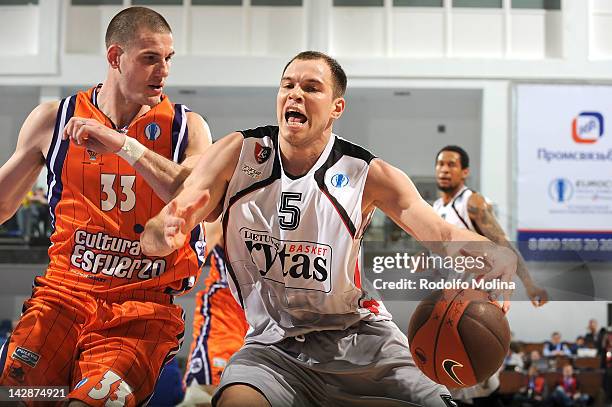 Steponas Babrauskas, #5 of Lietuvos Rytas competes with Nik Caner-Medley, #33 of Valencia Basket during the semifinal A of 2012 Eurocup Finals...