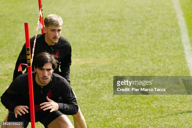 Alexis Saelemaekers and Sandro Tonali in action during an AC Milan training session at Milanello on September 29, 2022 in Cairate, Italy.
