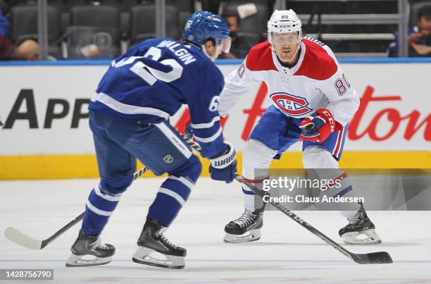 Gabriel Bourgue of the Montreal Canadiens defends against Denis Malgin of the Toronto Maple Leafs during an NHL pre-season game at Scotiabank Arena...