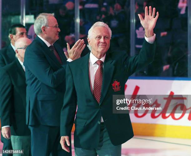 Team Canada 72 member Paul Henderson salutes the crowd during tribute celebration prior to action between the Montreal Canadiens and the Toronto...