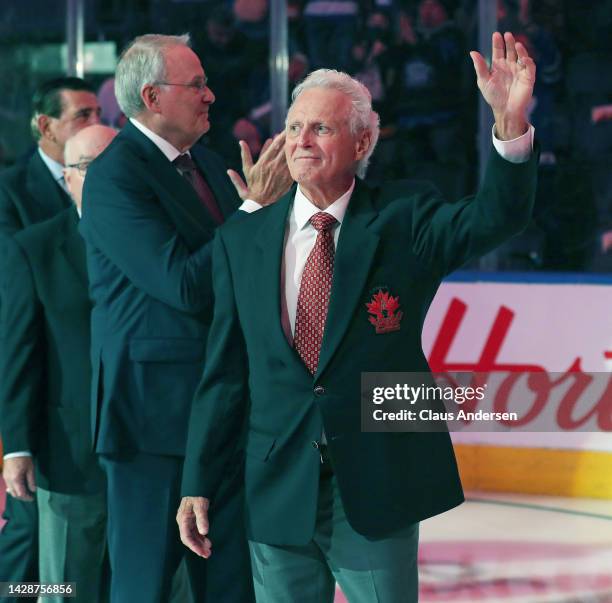 Team Canada 72 member Paul Henderson salutes the crowd during a tribute celebration prior to action between the Montreal Canadiens and the Toronto...