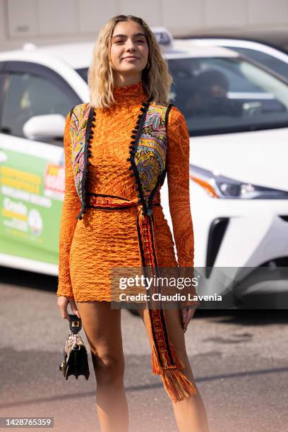 Alessia Lanza is seen wearing an orange turtleneck dress, paisley vest and a brown handbag outside the Etro show during the Milan Fashion Week -...