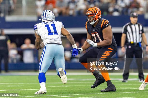 Lael Collins of the Cincinnati Bengals blocks Micah Parsons of the Dallas Cowboys at AT&T Stadium on September 18, 2022 in Arlington, Texas. The...