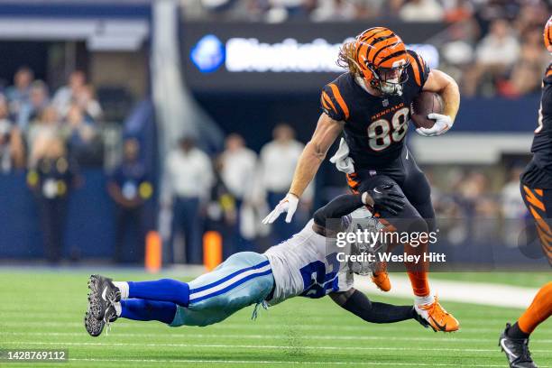 Hayden Hurst of the Cincinnati Bengals runs the ball and is hit by Malik Hooker of the Dallas Cowboys at AT&T Stadium on September 18, 2022 in...