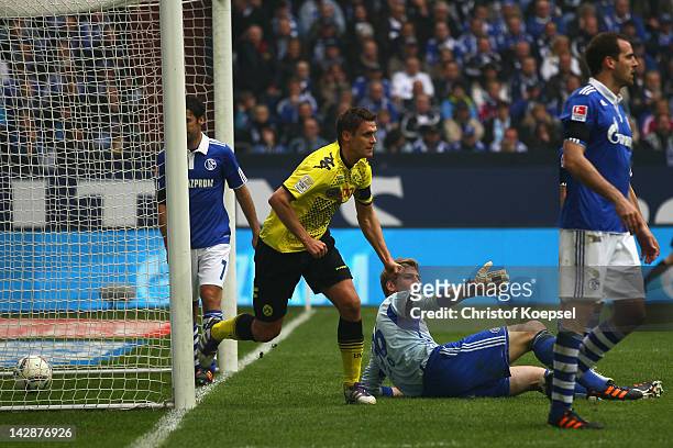 Sebastian Kehl of Dortmund celebrates the second goal against Schalke during the Bundesliga match between FC Schalke 04 and Borussia Dortmund at...