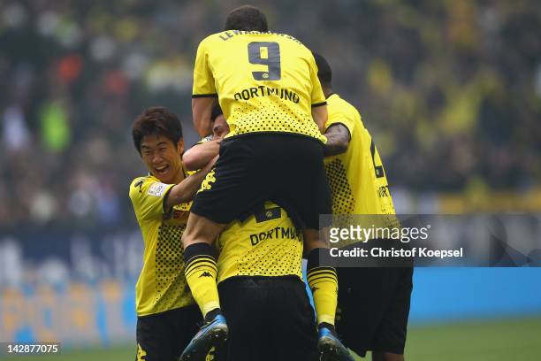 Sebastian Kehl of Dortmund celebrates the second goal with Shinji Kagawa , Robert Lewandowski and Felipe Santana of Dortmund during the Bundesliga...