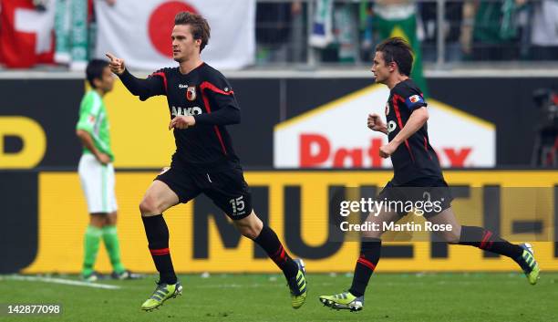 Sebastian Langkamp of Augsburg celebrates after he heads his team's 2nd goal during the Bundesliga match between VfL Wolfsburg and FC Augsburg at the...