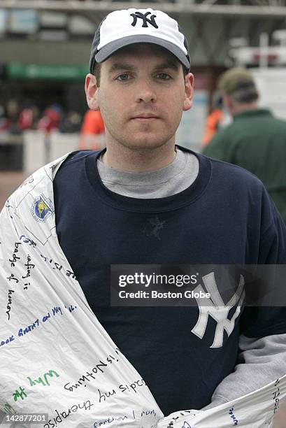 Runner/writer Tim Gorman of Melrose, after crossing the finish line of the Boston Marathon.