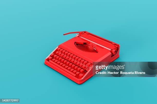 3d render of red typewriter on blue background, student concept - typewriter stockfoto's en -beelden
