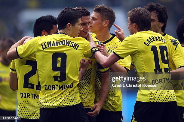 Sebastian Kehl of Dortmund celebrates the second goal with his team mates during the Bundesliga match between FC Schalke 04 and Borussia Dortmund at...