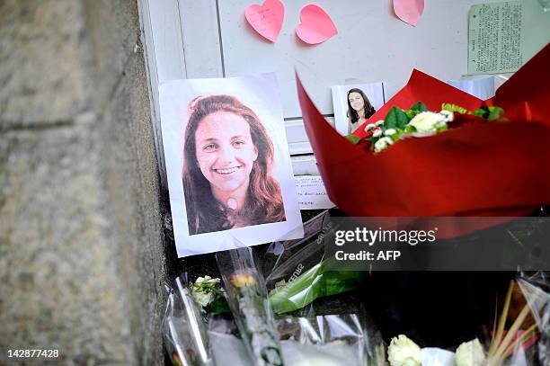 Picture taken on April 14, 2012 in Nantes, western France shows a portrait of late Agnes Dupont de Ligonnes with flowers laid down in front of the...