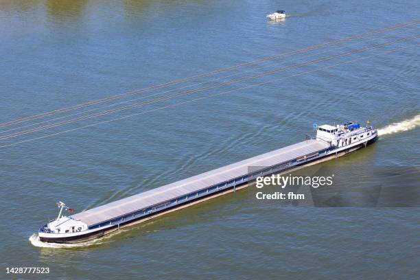 cargo ship on rhine river - barge stock-fotos und bilder