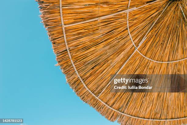 beach bamboo umbrella - parasol stockfoto's en -beelden