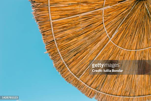 beach bamboo umbrella - beach vibes stock pictures, royalty-free photos & images
