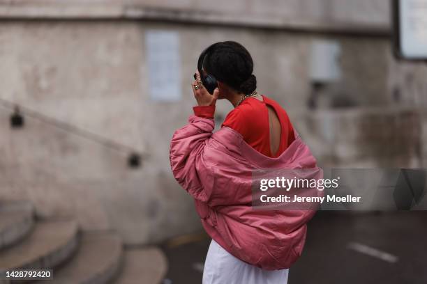 Fashion week guest seen wearing a tie dye red and white dress, outside Mame Kurogouchi during Paris Fashion Week on September 27, 2022 in Paris,...