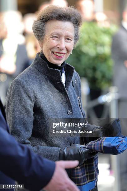 Princess Anne, Princess Royal holds a gifted scarf made from St James Quarter tartan, designed by Edinburgh College of Art graduate Rosie Baird...