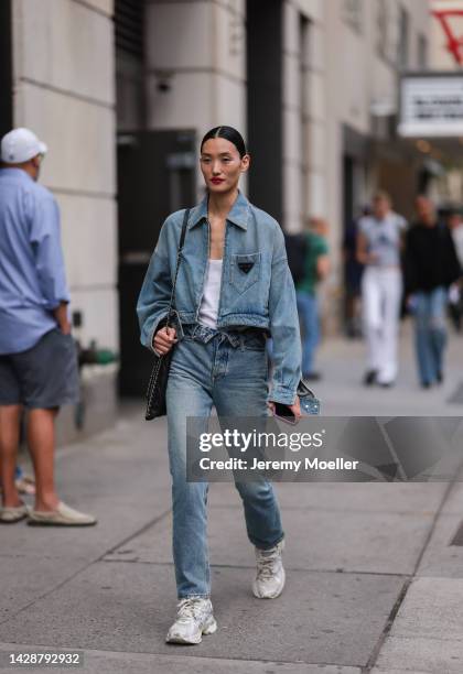 Fashion week guest seen wearing a denim look, outside Carolina Herrera during new york fashion week on September 12, 2022 in New York City.