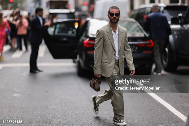 Pelayo Díaz seen wearing a matching suit, outside Carolina Herrera during new york fashion week on September 12, 2022 in New York City.