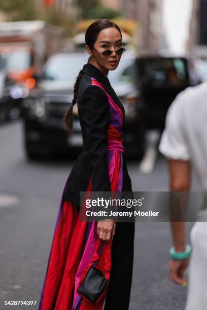 Chriselle Lim seen wearing a black look with pink highlights, outside Carolina Herrera during new york fashion week on September 12, 2022 in New York...