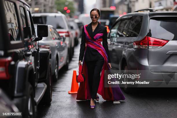 Chriselle Lim seen wearing a black look with pink highlights, outside Carolina Herrera during new york fashion week on September 12, 2022 in New York...