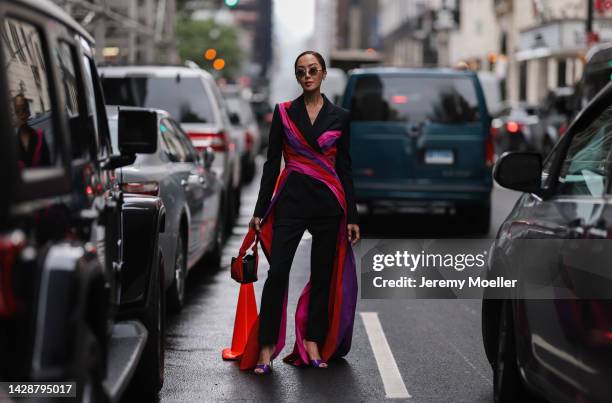 Chriselle Lim seen wearing a black look with pink highlights, outside Carolina Herrera during new york fashion week on September 12, 2022 in New York...