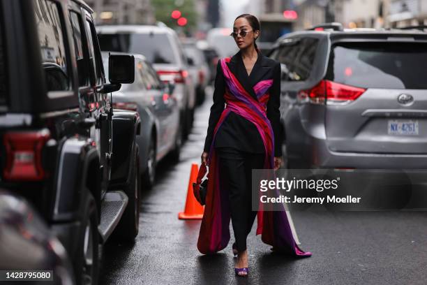 Chriselle Lim seen wearing a black look with pink highlights, outside Carolina Herrera during new york fashion week on September 12, 2022 in New York...