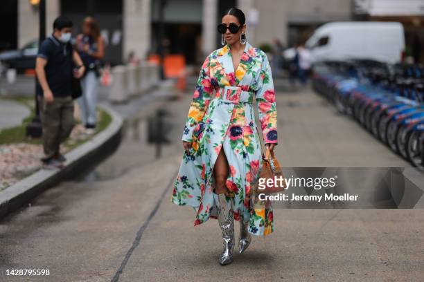 Fashion week guest seen wearing a colourful flowerdress, outside Carolina Herrera during new york fashion week on September 12, 2022 in New York City.