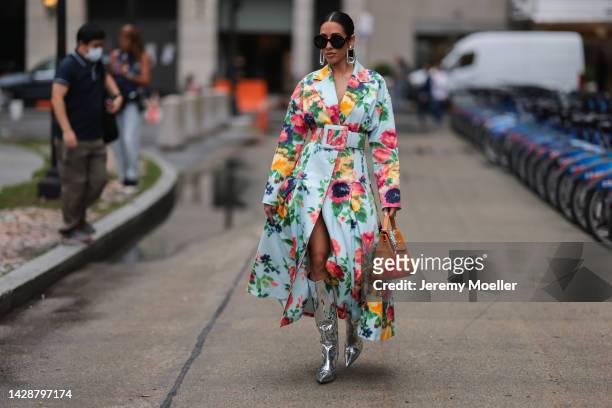 Fashion week guest seen wearing a colourful flowerdress, outside Carolina Herrera during new york fashion week on September 12, 2022 in New York City.