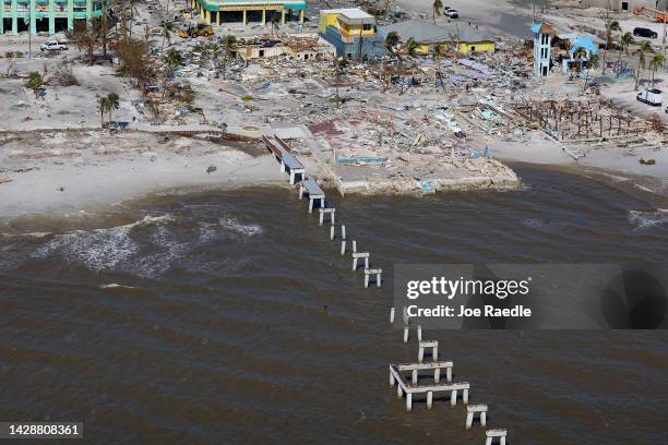 The pilings from Fort Myers Beach pier are all that are left after Hurricane Ian passed through the area on September 29, 2022 in Fort Myers Beach,...