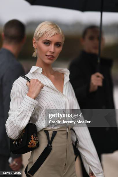 Iris Law seen wearing a total dior look, outside Christian Dior during Paris Fashion Week on September 27, 2022 in Paris, France.