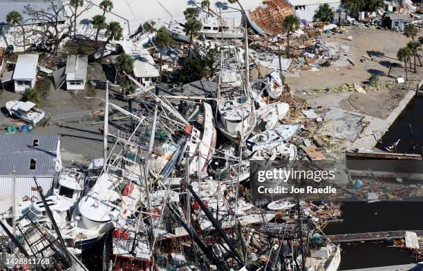 In an aerial view, boats are piled on top of each other after Hurricane Ian passed through the area on September 29, 2022 in Fort Myers Beach,...