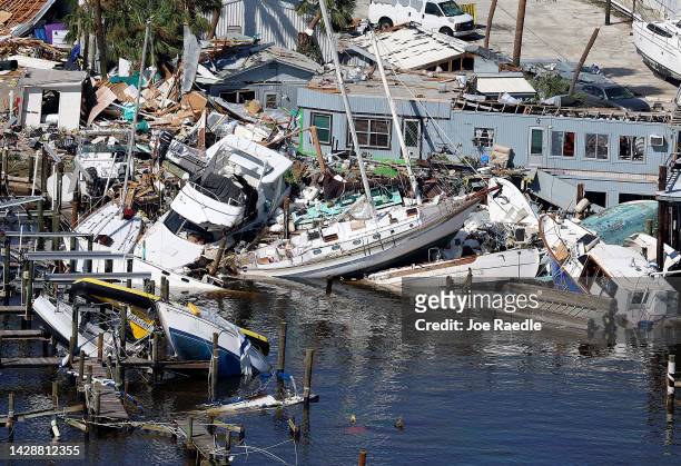 In an aerial view, boats are piled on top of each other after Hurricane Ian passed through the area on September 29, 2022 in Fort Myers Beach,...