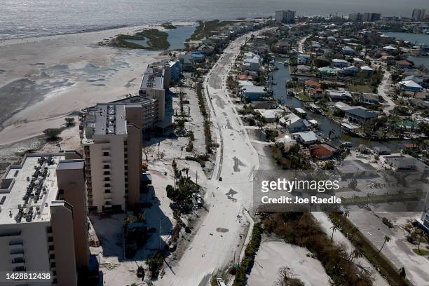 In an aerial view, beach sand covers a roadway after Hurricane Ian passed through the area on September 29, 2022 in Fort Myers Beach, Florida. The...