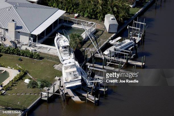 In an aerial view, boats are seen along side a home after Hurricane Ian passed through the area on September 29, 2022 in Fort Myers Beach, Florida....