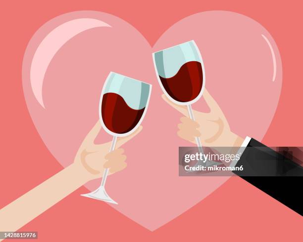 vector of a couple drinking wine on a special romantic occasion - drinking glass vector stock pictures, royalty-free photos & images