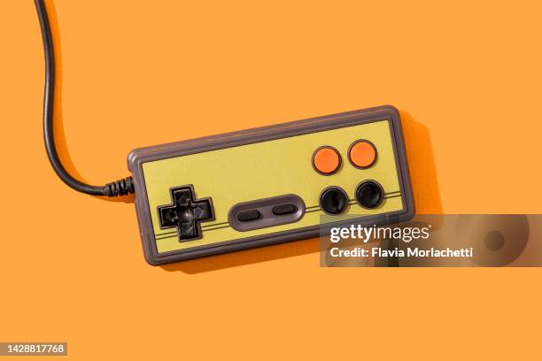 retro video game joystick - gaming controller stock pictures, royalty-free photos & images