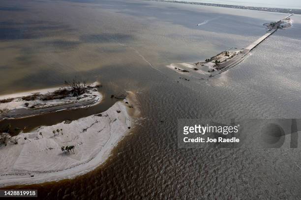 In this aerial view, parts of Sanibel Causeway are washed away along with sections of the bridge after Hurricane Ian passed through the area on...