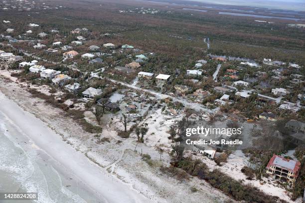 In this aerial view, homes show some damage after Hurricane Ian passed through the area on September 29, 2022 in Sanibel, Florida. The hurricane...