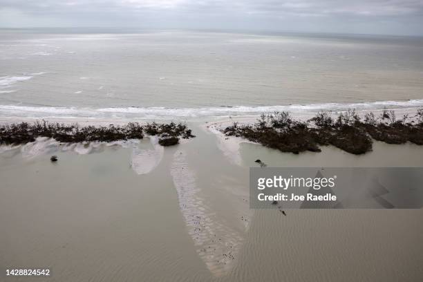 In this aerial view, part of the barrier island is washed away after Hurricane Ian passed through the area on September 29, 2022 in Sanibel, Florida....