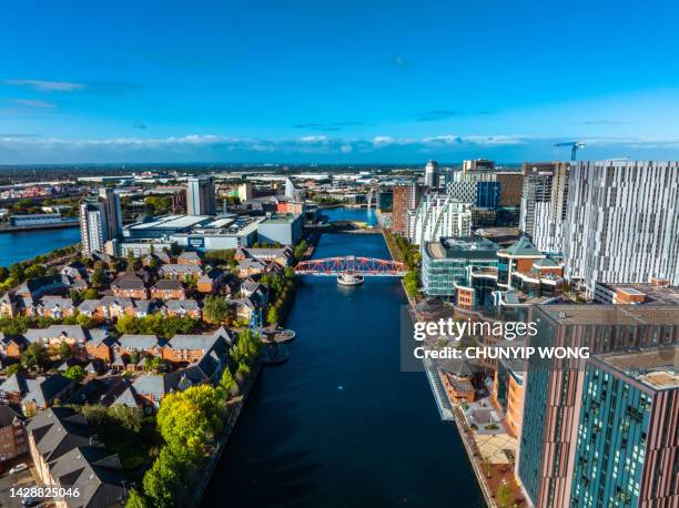 drone view of media city salford quays, manchester - manchester high street stock pictures, royalty-free photos & images