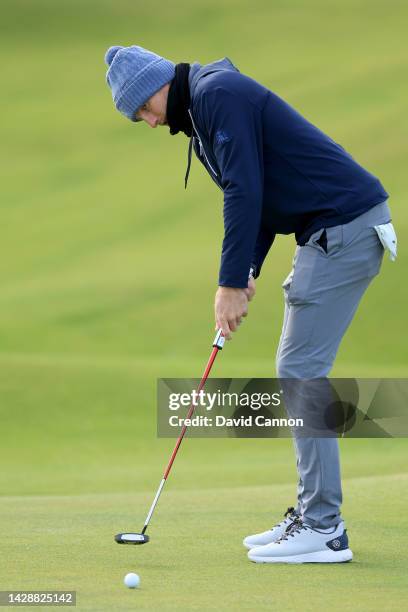 Joe Root of England the former England Test cricket captain and leading batsman hits a putt on the second hole on Day One of the Alfred Dunhill Links...